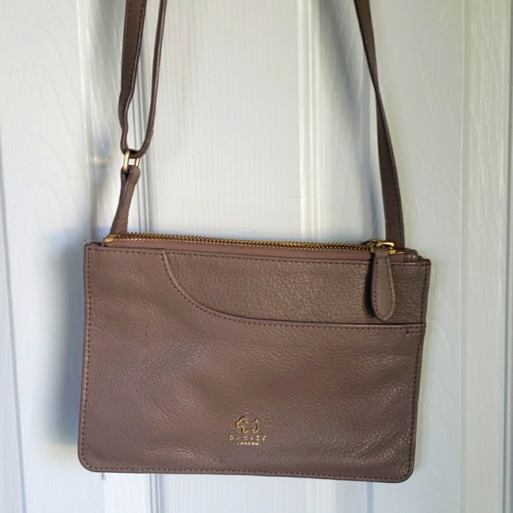 Radley leather pockets cross body. Size is 9 x 7. Excellent condition.
